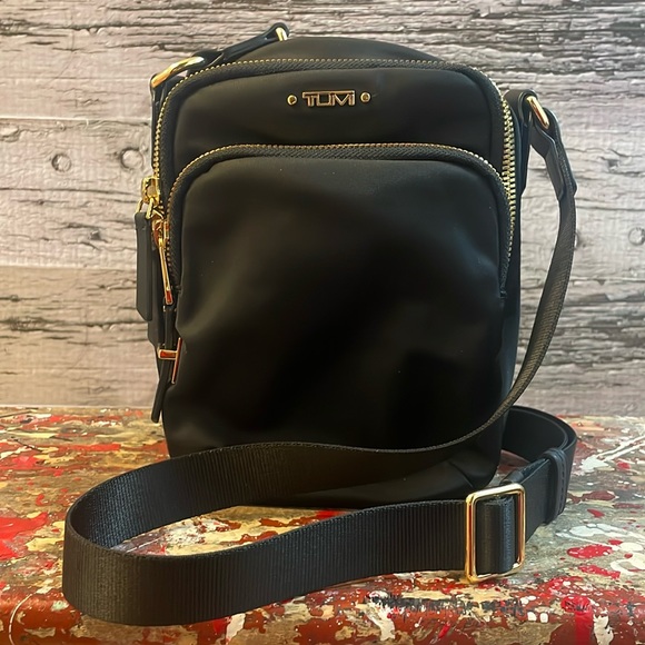 Tumi Handbags - Tumi Black and Gold Accent Voyageur Ruma Nylon Crossbody Bag